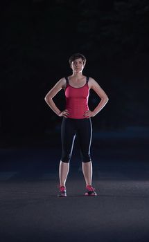 runner   woman warming up and stretching before morning jogging