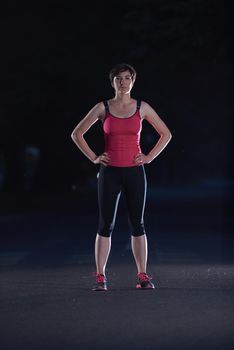 runner   woman warming up and stretching before morning jogging