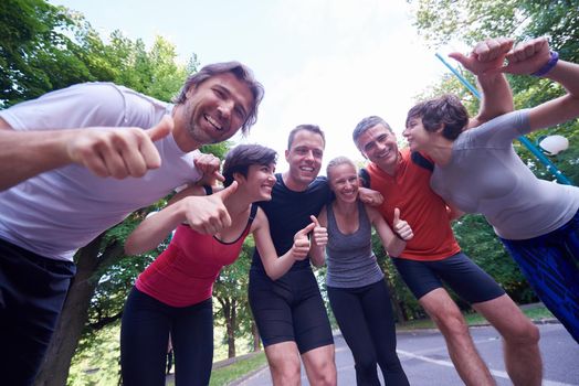 jogging people group, friends have fun,  hug and stack hands together after training