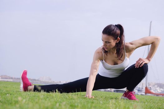 Young beautiful  woman jogging and running  on morning at  park in the city. Woman in sport outdoors health and fitness concept