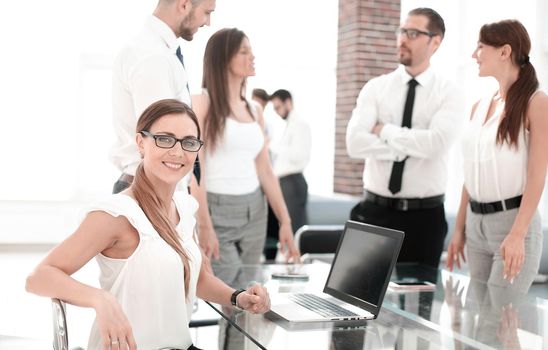 young business woman sitting in front of open laptop . business concept