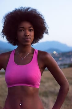 Healthy Looking Smiling Young African American Female beautiful summer evening in nature