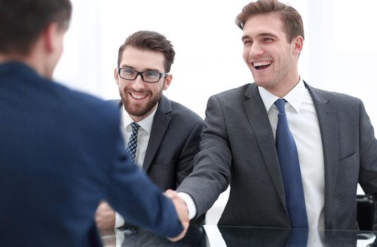 close up.businessman welcomes new business partner.