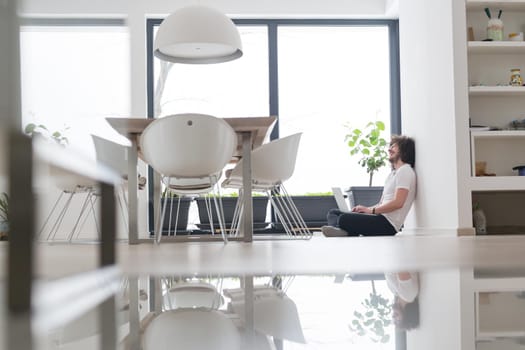 Real man Using laptop on the floor At Home  Enjoying Relaxing