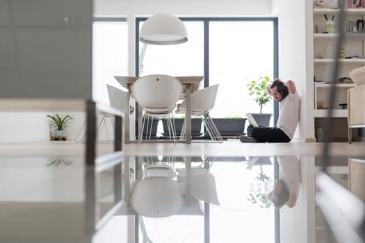 Real man Using laptop on the floor At Home  Enjoying Relaxing