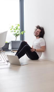 Real man Using laptop on the floor At Home  Enjoying Relaxing