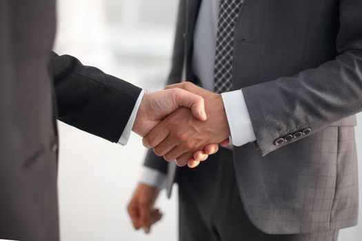 close up. handshake business partners .the concept of cooperation