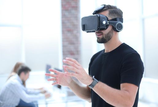 Hipster on confident face driving car in virtual reality with modern digital gadget.