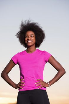 portrait of a young African American girl to run beautiful summer evening on city streets