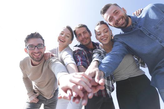 active young people ,with hands clasped together.photo with copy space