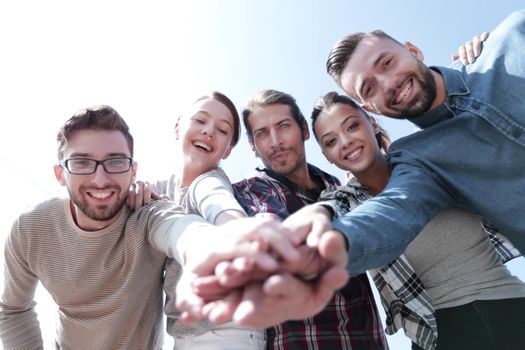 active young people ,with hands clasped together.photo with copy space