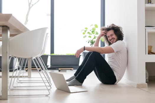 Real man Using laptop on the floor At Home  Enjoying Relaxing