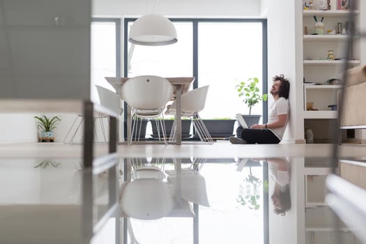 Real man Using laptop on the floor At Home  Enjoying Relaxing