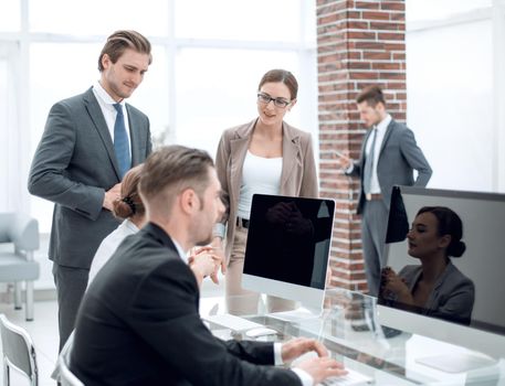 Bank employees sitting at the Desk.people and technology