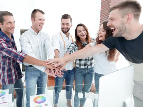 handshake colleagues in creative Studio .the concept of a creative team