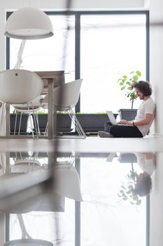 Real man Using laptop on the floor At Home  Enjoying Relaxing