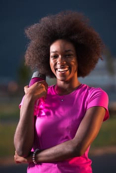 portrait of a young African American girl to run beautiful summer evening on city streets