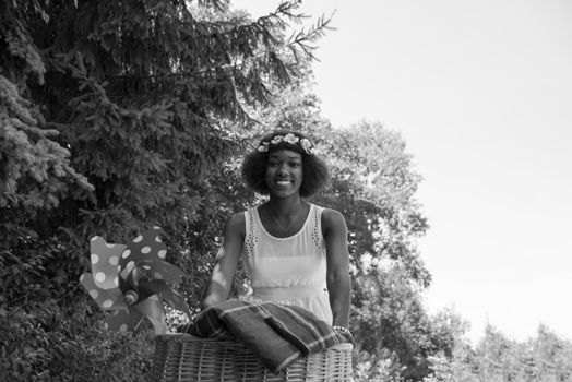 beautiful young African American women enjoy while riding a bicycle in the woods on a sunny summer day