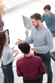 Business people discuss something at the meeting at the modern office building.