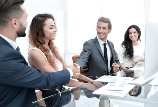 handshake colleagues at a working meeting in the office.