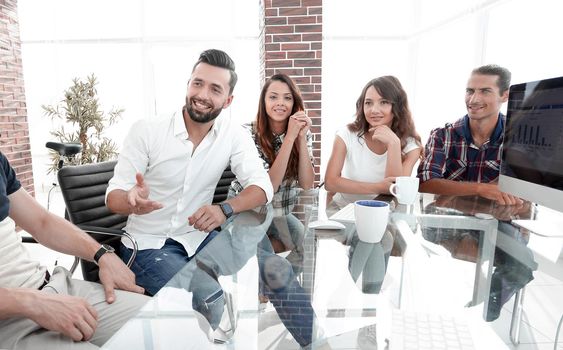 business team sitting at a modern Desk.photo with copy space