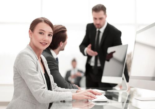 young employee sitting at his Desk.the concept of teamwork