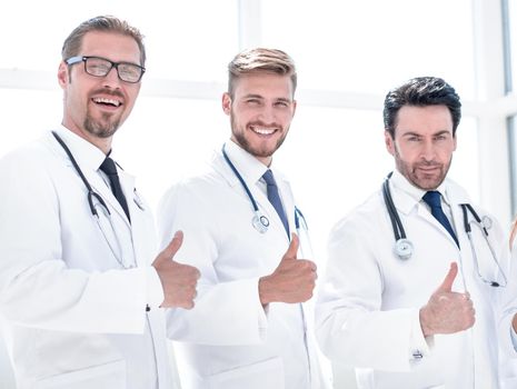 group of doctors showing thumbs up.the concept of health and service