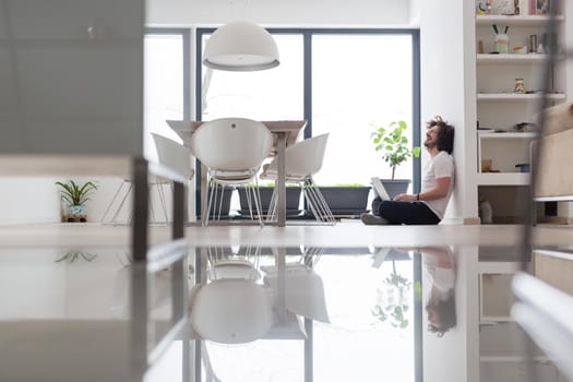 Real man Using laptop on the floor At Home  Enjoying Relaxing