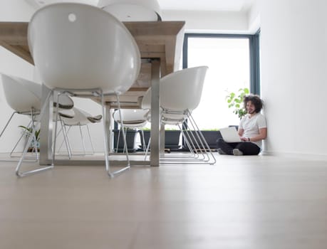 Real man Using laptop on the floor At Home  Enjoying Relaxing