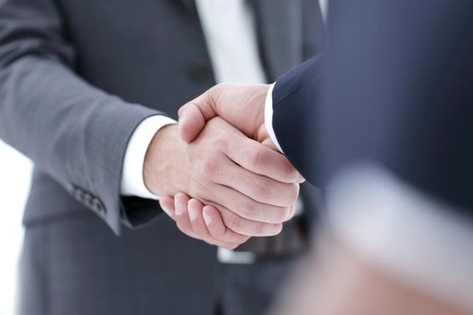 Close-up view of the hands of a businessman in the office in the formal wear.