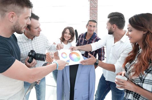 team of designers discussing the color palette in the Studio