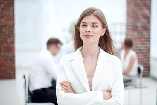 dreams of a young business woman standing in office.photo with copy space