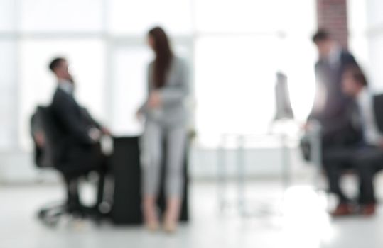 Businessman blur in the workplace or work space of table work in office with computer or shallow depth of focus of abstract background.