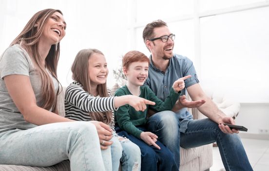 happy family watching their favorite TV show.photo with copy space