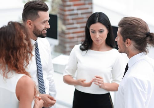 business team standing in front of a flipchart.photo with copy space