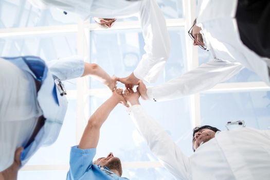 Low Angle View Of Medical Team Stacking Hands