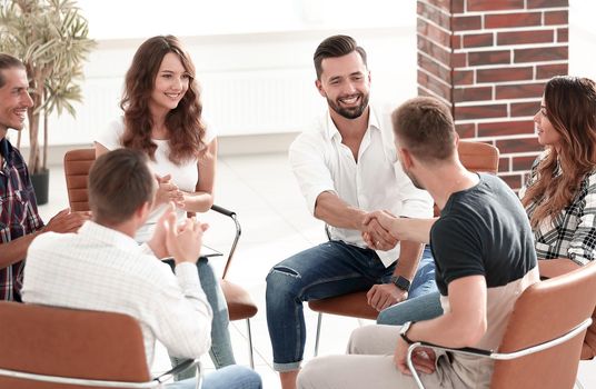 friendly handshake colleagues when meeting at the workshop