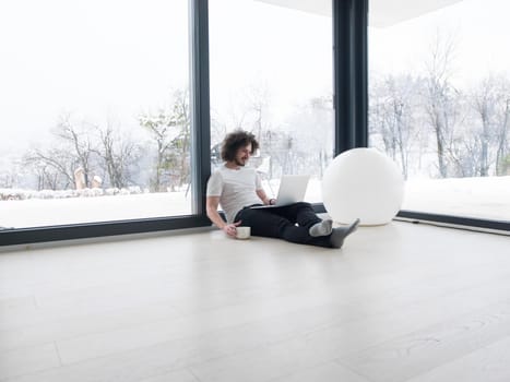 Real man Using laptop on the floor At Home  Enjoying Relaxing