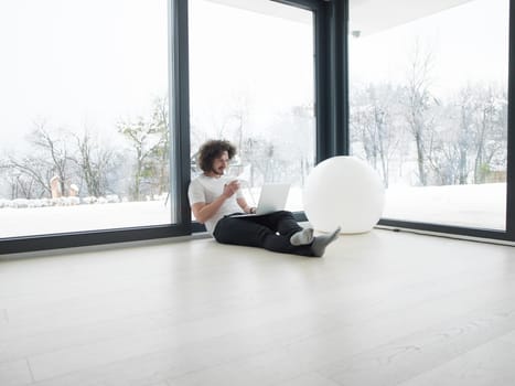 Real man Using laptop on the floor At Home  Enjoying Relaxing