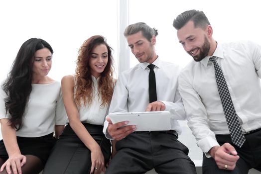 closeup.business colleagues with digital tablet.