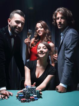 young brunette playing Texas Holdem Poker goes All In