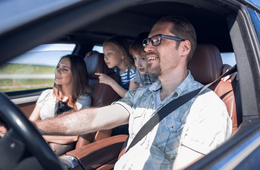 side view.happy family rides in the car.the concept of freedom and travel