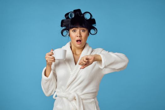 housewife with curlers on her head cleaning housework. High quality photo