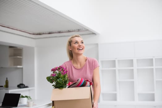 Beautiful girl moving in the new apartment