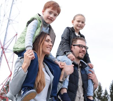 parents and their children have fun together.happy family concept