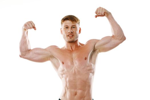 male athlete with pumped up muscular body posing fitness. High quality photo