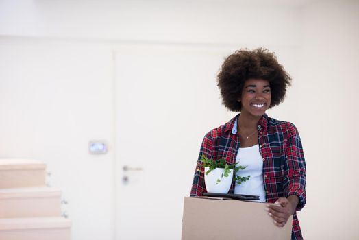 Beautiful African  American girl moving in the new apartment