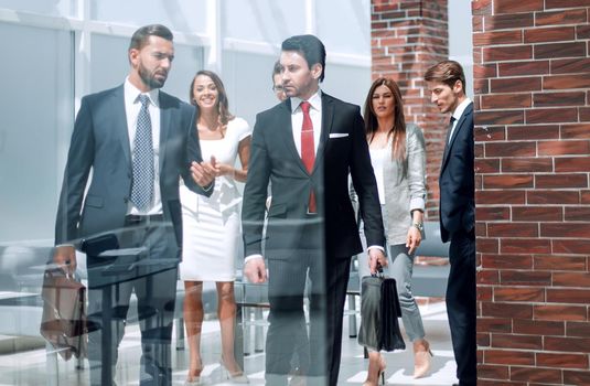 group of business people passing through the lobby of the business center.photo with copy space