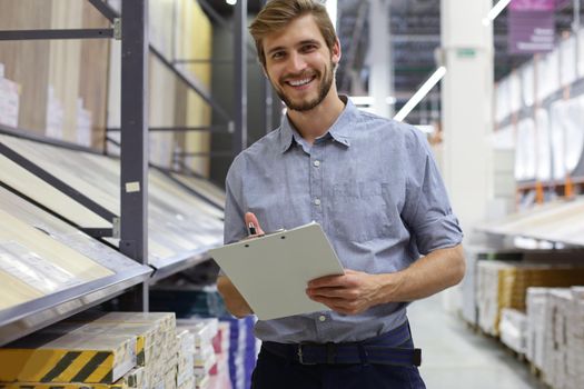 Manager use his tablet for online checking products available