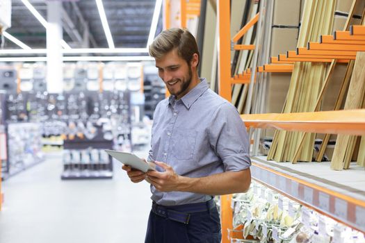 Manager use his tablet for online checking products available